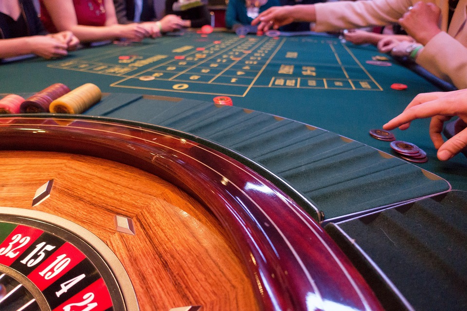 Online casino table games concept: roulette wheel and playing cards